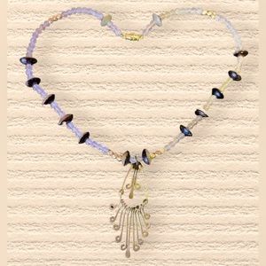 Unique vintage style necklace with stone and gold tones. NWOT